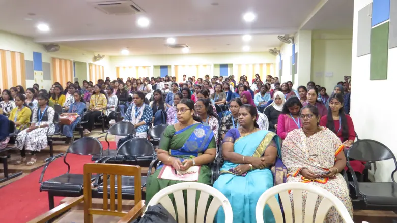 A full hall of college students at a career talk